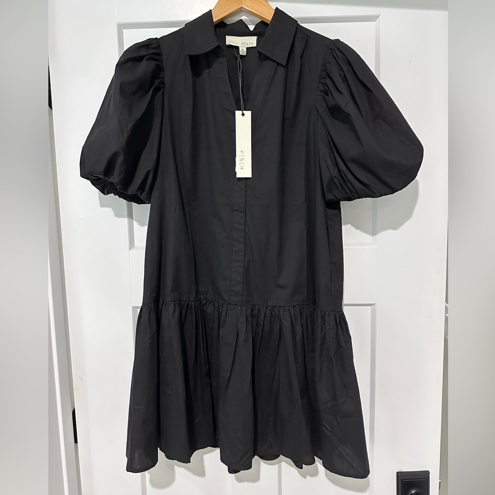 Black v-neck dress from Pinch. Super cute just too short for me.